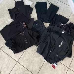 Lot of black scrubs. 5 bottoms 6 tops and 3 jackets one jacket still NWT.